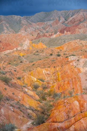 Eroded mountain landscape, sandstone cliffs, canyon with red and orange rock formations, Konorchek Canyon, Chuy, Kyrgyzstan, Asia