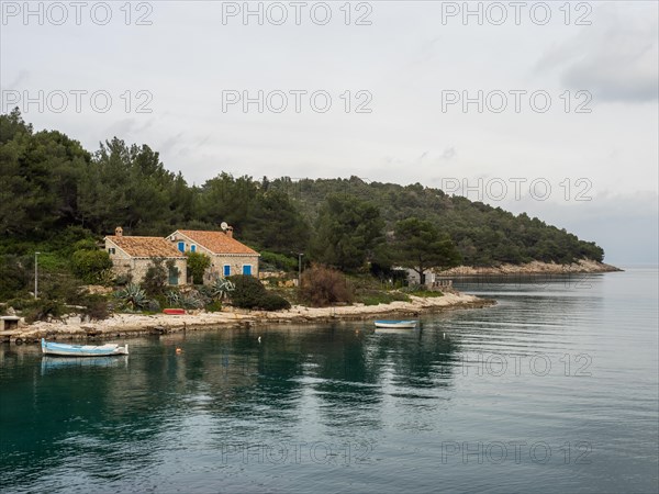 View from the promenade path to a small house by the sea, near Veli Losinj, Kvarner Bay, Croatia, Europe