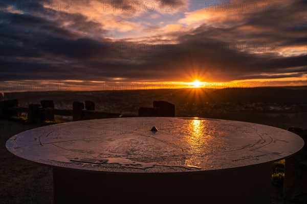 Sunset seen over an orientation board on a hill, memorial of the Second World War, Pforzheim, Germany, Europe