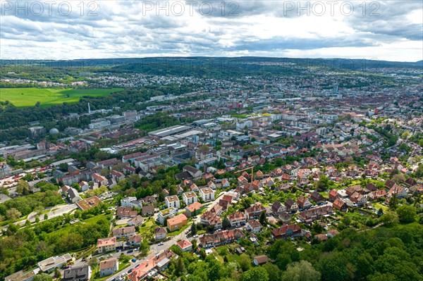Aerial view of a city with dense buildings, surrounded by green areas and a cloudy sky, Pforzheim, Germany, Europe