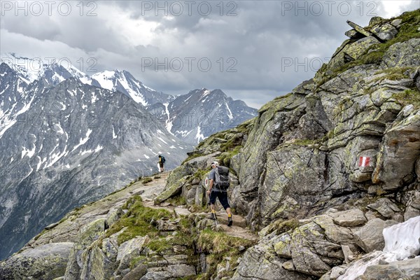 Two mountaineers on a hiking trail, mountain landscape with rocky peaks, Berliner Hoehenweg, Zillertal Alps, Tyrol, Austria, Europe