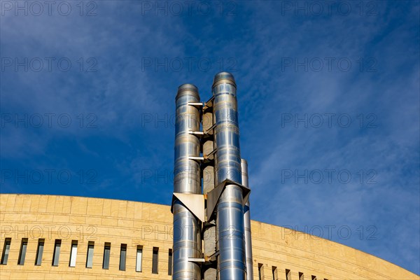 Modern Design Building Against Blue Sky and Metal Chimney in Campione d'Italia, Lombardy, Italy, Europe