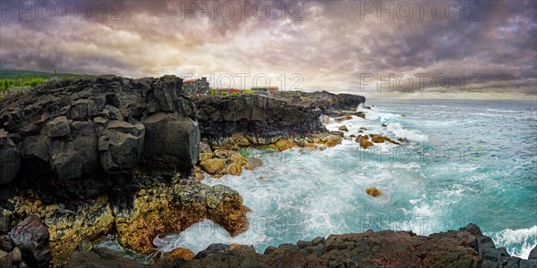 View of the wild coastline with rugged cliffs of lava rock and roaring waves under a grey sky, North Coast, Santa Luzia, Pico, Azores, Portugal, Europe