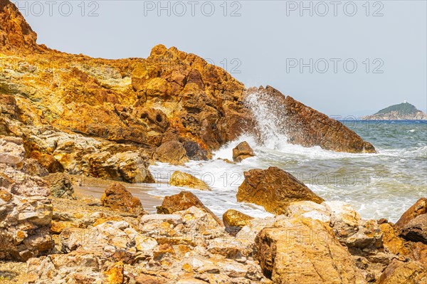 Mineral rocks washed by the sea on the beach of Topinetti, near Rio Marina, Elba, Tuscan Archipelago, Tuscany, Italy, Europe