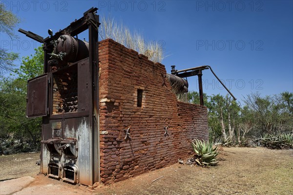 German decommissioned steam engine from 1904 at Lake Otjikoto, used as a pump to supply drinking water to the town of Tsumeb in Namibia