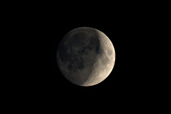 Waxing crescent moon seen with telescope