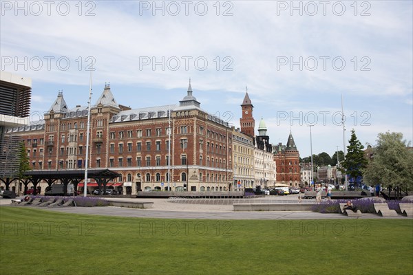 Angfaerjepark on the quay promenades, behind a traditional house and the town hall, Helsingborg, Skane laen, Sweden, Europe