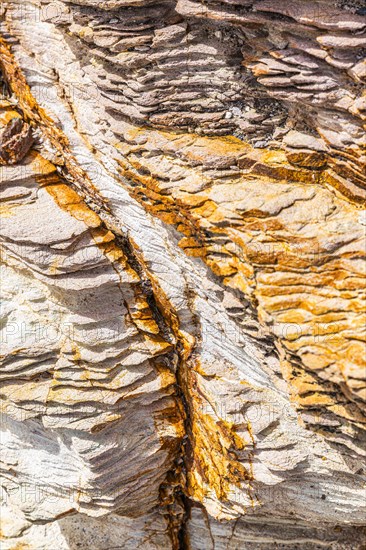 Coloured, ferruginous mineral sandstone on Topinetti beach, near Rio Marina, Elba, Tuscan Archipelago, Tuscany, Italy, Europe