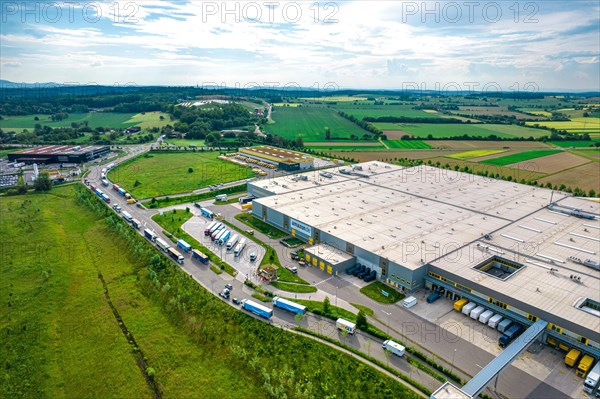 Aerial view of an industrial area with large warehouses and surrounding fields, Amazon, Pforzheim, Germany, Europe
