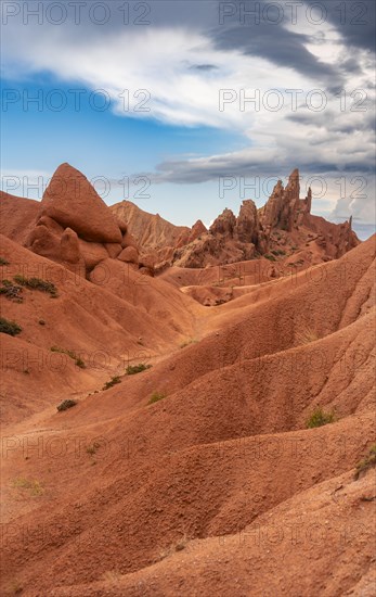 Eroded mountain landscape, sandstone cliffs, canyon with red and orange rock formations, Konorchek Canyon, Chuy, Kyrgyzstan, Asia