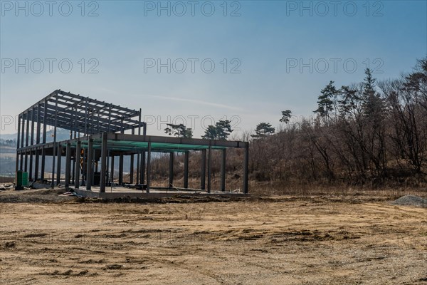 Chungju, South Korea, March 22, 2020: For editorial use only. Metal frame of industrial building at new rural construction site, Asia