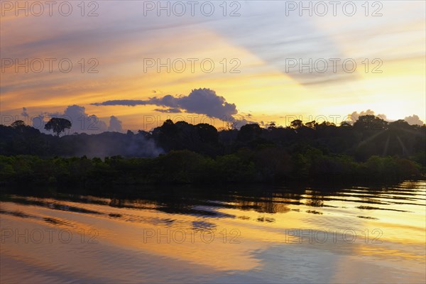 Sunset on the Madeira River, an Amazon tributary, Amazonas state, Brazil, South America