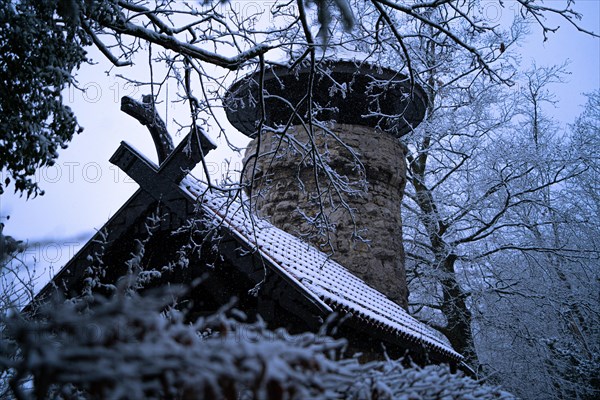 Snow-covered tree house surrounded by trees in a wintry atmosphere, Hachelturm, Pforzheim, Germany, Europe