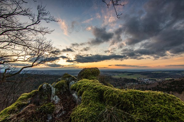 Landscape at the Grosser Zacken, Taunus volcanic region. A cloudy, sunny autumn day, meadows, hills, fields and forests with a view of the sunset. Hesse, Germany, Europe