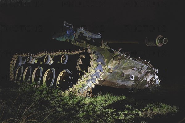 A night-time scenario with an abandoned tank, artificial lighting sets the scene, M41 Bulldog, Lost Place, Brander Wald, Aachen, North Rhine-Westphalia, Germany, Europe