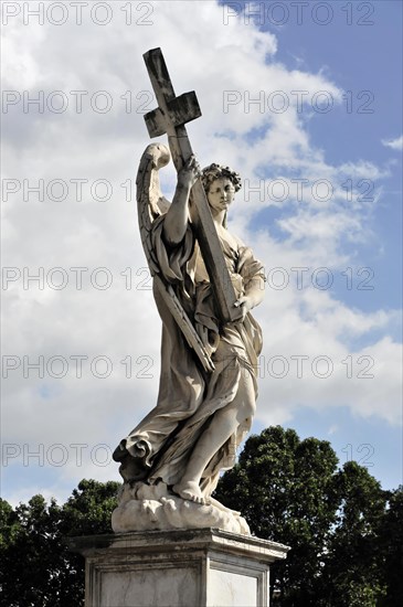 Statue of an angel with a cross on the Bridge of Angels over the Tiber, Rome, Italy, Europe