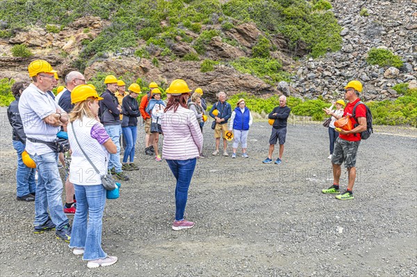 Tourist group on a guided tour of the former Miniere Calamita mine, Elba, Tuscan Archipelago, Tuscany, Italy, Europe