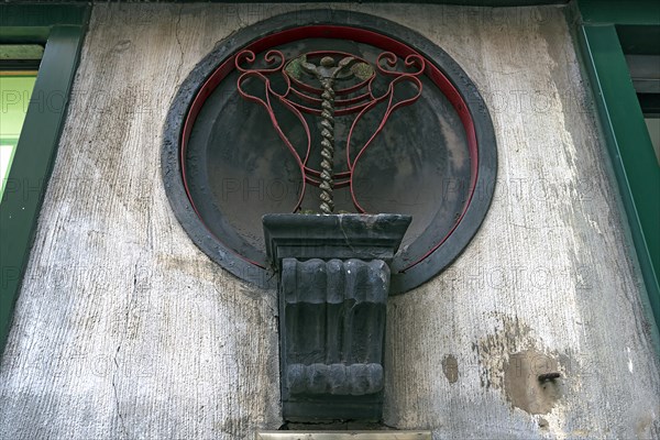 The staff of Asclepius on an old pharmacy, around 1900, Genoa, Italy, Europe