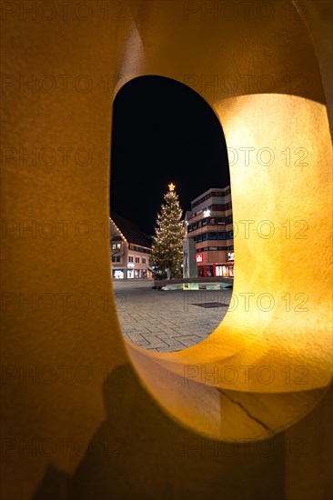 View through an illuminated ring onto a Christmas tree at night, Nagold, Black Forest, Germany, Europe