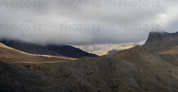 Low hanging clouds in the mountain landscape at the Tizi-n-Tichka pass road, High Atlas, Morocco, Africa