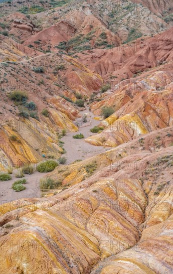 Eroded mountain landscape, sandstone cliffs, canyon with red and orange rock formations, Konorchek Canyon, Chuy, Kyrgyzstan, Asia