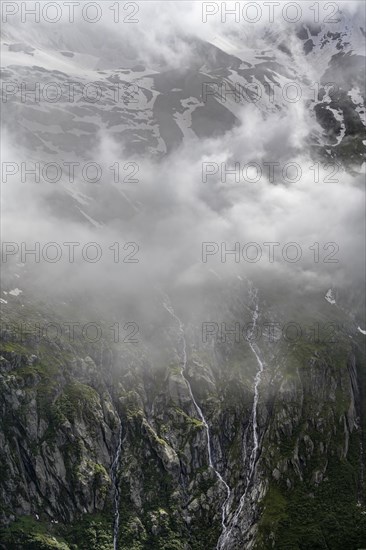 Cloudy mountain landscape, mountain streams as waterfalls on a mountain slope, Furtschaglhaus, Berliner Hoehenweg, Zillertal, Tyrol, Austria, Europe