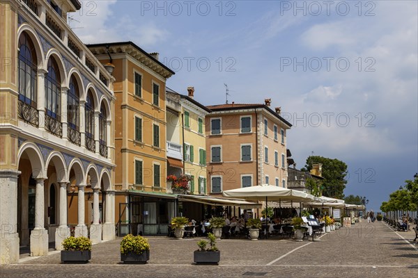 Waterfront promenade with restaurants in Gargnano, Lake Garda, Province of Brescia, Lombardy, Italy, Europe