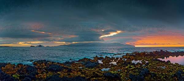 Extensive volcanic coastal landscape of Madalena at sunset with dynamic cloud formations, Madalena, Pico, Azores, Portugal, Europe