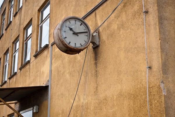 Stagnant, old clock on decaying building, symbol of transience, passage of time, ageing, need for renovation, decay, vacancy, Mecklenburg-Western Pomerania, Germany, Europe