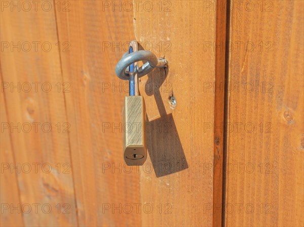 Padlock on a wood door