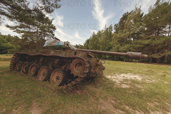 Abandoned tank rusting in a field next to trees, M41 Bulldog, Lost Place, Brander Wald, Aachen, North Rhine-Westphalia, Germany, Europe