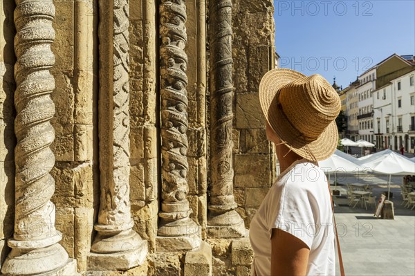 Woman visiting a romanesque church, Coimbra, Igreja de Sao Tiago