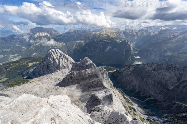 View from the rocky summit of the Watzmann Mittelspitze, view of mountain panorama with Steinernes Meer and Koenigssee, Kleiner Watzmann and Watzmann Kinder, Watzmann crossing, Berchtesgaden National Park, Berchtesgaden Alps, Bavaria, Germany, Europe