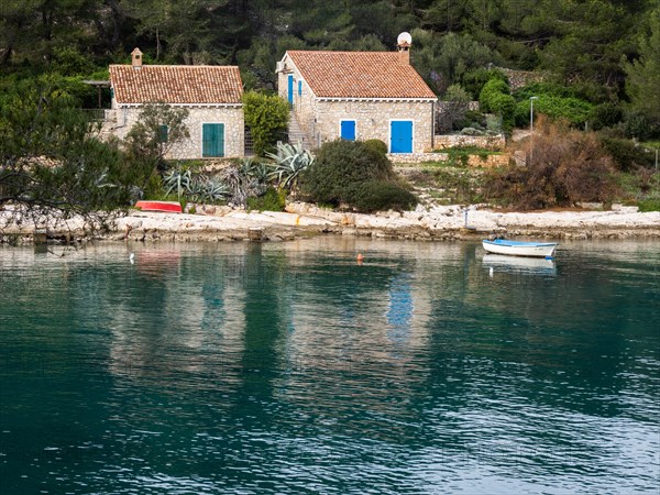View from the promenade path to a small house by the sea, near Veli Losinj, Kvarner Bay, Croatia, Europe
