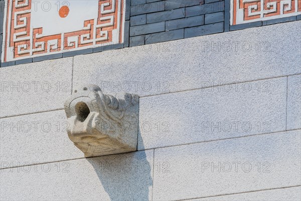 Seoul, South Korea, March 18, 2017:Concrete dragon figure mounted in the wall of Gyeong Bok Gung Palace in Seoul, South Korea, Asia
