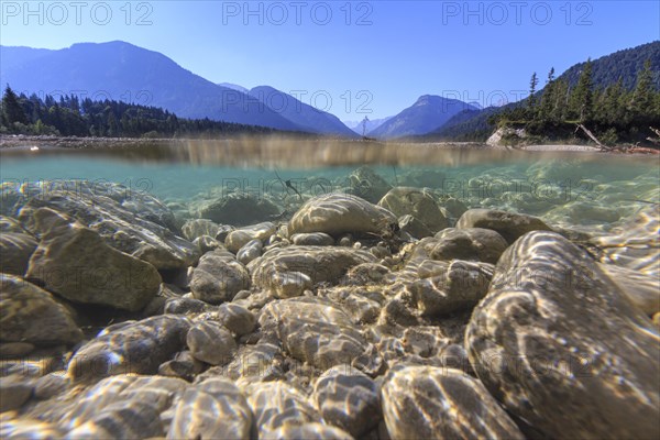 Underwater shot of river in front of mountains, midday light, Isar, Vorderriss, Karwendel Mountains, Bavaria, Germany, Europe