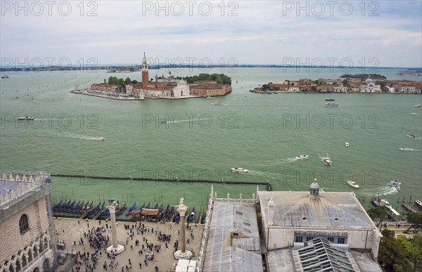 Aerial view from the Bell Tower (Campanile di San Marco) with Piazza San Marco, gondolas and the island with San Giorgio Maggiore church, in Venice, Italy, Europe