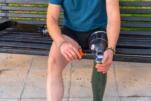 Close-up of a man without leg with sports prosthesis preparing to run