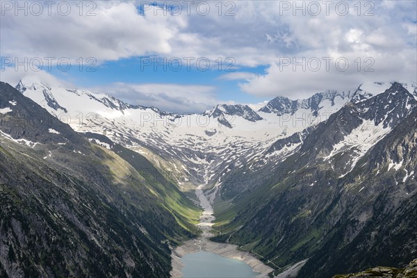 Mountain landscape, view of turquoise-blue lake Schlegeisspeicher, glaciated rocky mountain peaks Hoher Weisszint and Hochfeiler with glacier Schlegeiskees, Berliner Hoehenweg, Zillertal Alps, Tyrol, Austria, Europe