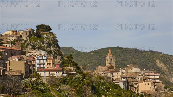 Historic town on a hillside with a striking church tower and nature in the background, Novara di Sicilia, Sicily, Italy, Europe