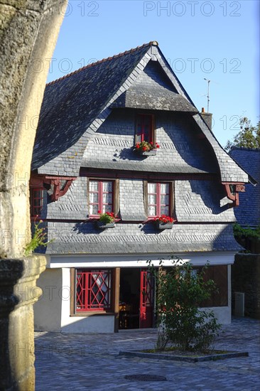 Rue du General de Gaulle in the old town centre of Le Faou with slate-roofed granite houses from the 16th century, Finistere department, Brittany region, France, Europe