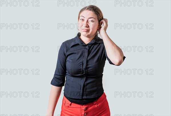 Person scratching head with indecisive expression isolated. Cute woman scratching her head with doubtful expression