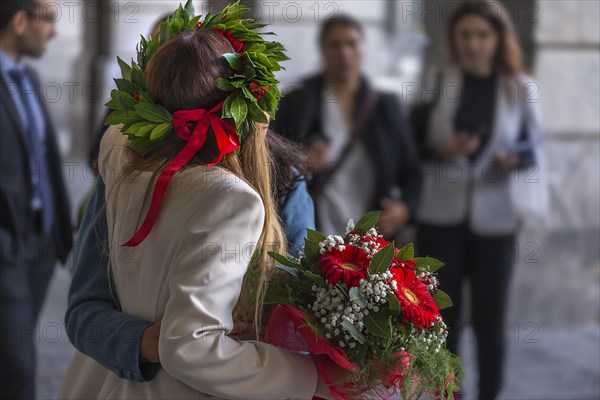 Graduate of the University of Genoa with traditional laurel wreath and red ribbon and bouquet of flowers, Genoa, Italy, Europe