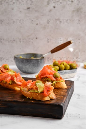 Closeup view of sandwiches with salted salmon and avocado puree