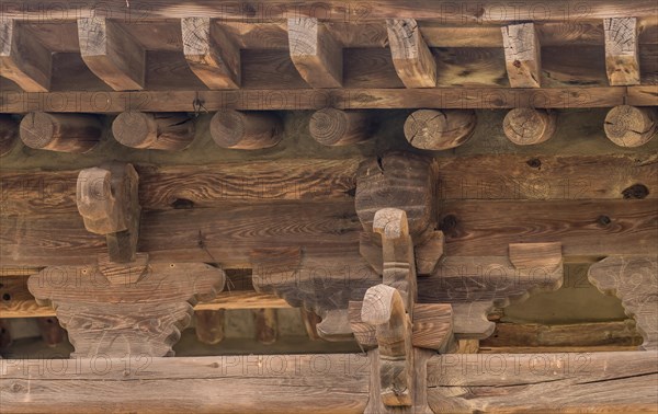 View of underside of roof of an old, unused oriental pavilion in a wooded area in South Korea