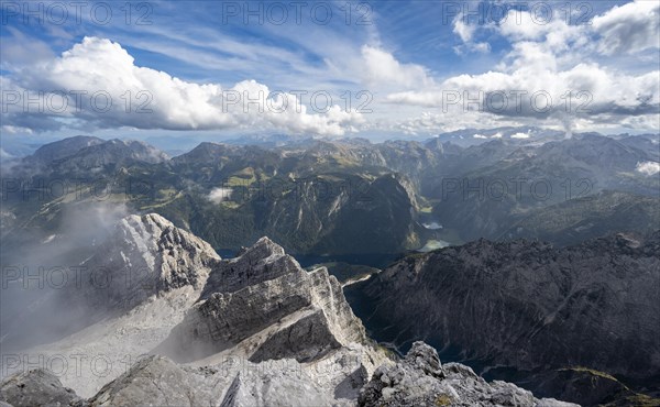 View from the rocky summit of the Watzmann Mittelspitze, view of mountain panorama with Steinernes Meer and Koenigssee, Kleiner Watzmann and Watzmann Kinder, Watzmann crossing, Berchtesgaden National Park, Berchtesgaden Alps, Bavaria, Germany, Europe