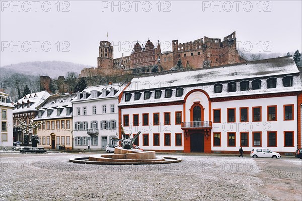 Heidelberg, Germany, February 2020: Town square called 'Karlsplatz' with snow in winter in historic city center of Heidelberg, Europe