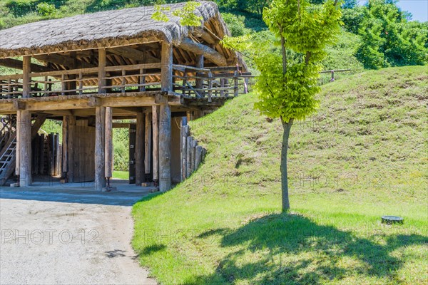 Wooden gate of traditional village made of logs and wooden planks with house jacks holding up support columns