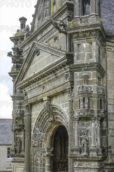 Side portal of the church, Enclos Paroissial parish of Guimiliau, Finistere Penn ar Bed department, Brittany Breizh region, France, Europe