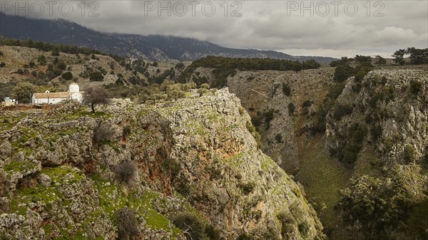 Church of St Michael the Archangel, Cross-domed church, Lonely building on a cliff with threatening clouds in the sky, Aradena Gorge, Aradena, Sfakia, Crete, Greece, Europe